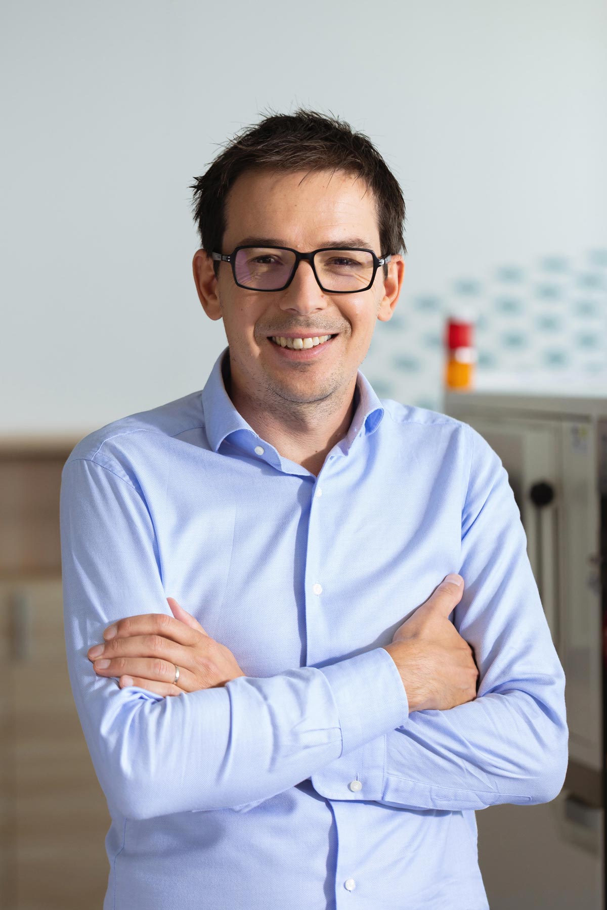Founder of Petspemf smiling in a bright clinic